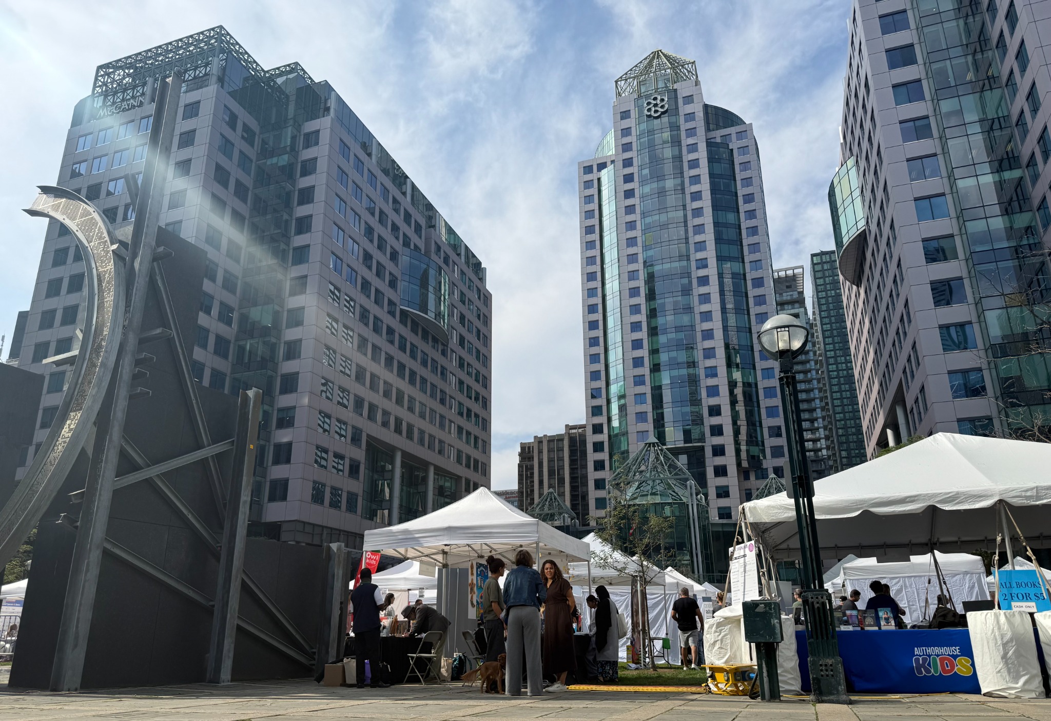Photo of the event site with tents and skyscrapers
